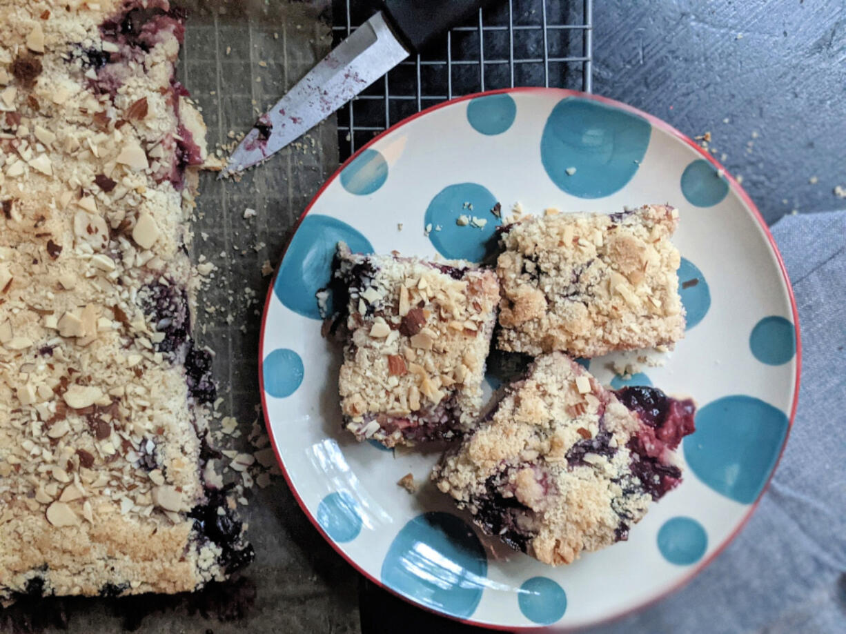 A mix of blueberries and chopped strawberry offer a taste of summer in these easy crumble bars.