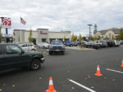 Customers try to find parking in the crowded Chick-fil-A parking lot on Southeast Mill Plain Boulevard in November 2016. The company recently submitted a preliminary application to expand its drive-thru capacity.