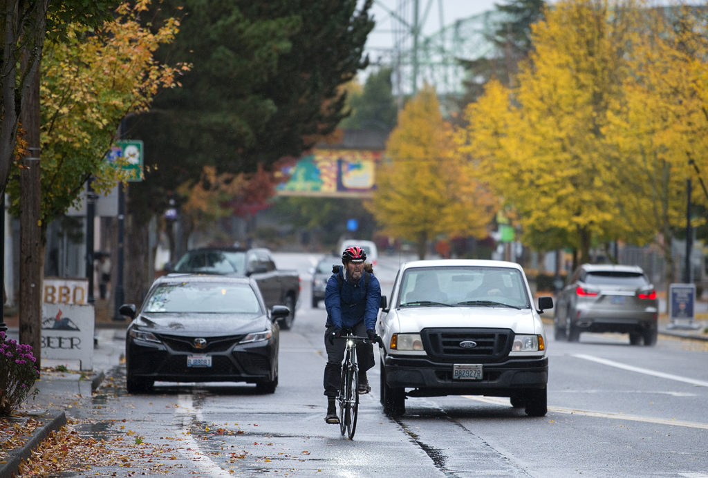 A cyclist navigates through traffic on Columbia Street south of the intersection with West Sixth Street in 2018.