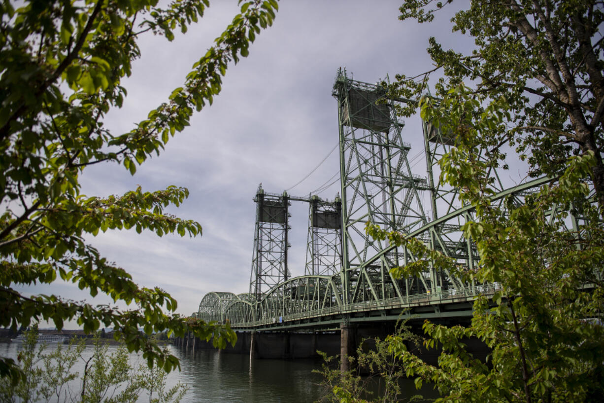 Foliage frames a view of the Interstate 5 Bridge last month.