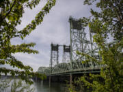 Foliage frames a view of the Interstate 5 Bridge last month.