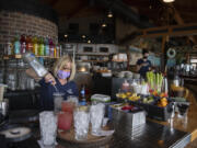 Kathleen Olson of Beaches restaurant makes drinks for lunchtime customers on Thursday morning, May 6, 2021. Beaches, along with most restaurants in Vancouver, is having trouble filling open positions.