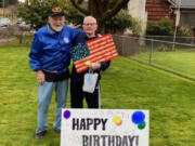 WASHOUGAL: At left is Bob Rodgers with Robert "Bob" Peake, holding the wooden flag that was presented to Peake on his 90th birthday by the Patriot Guard.