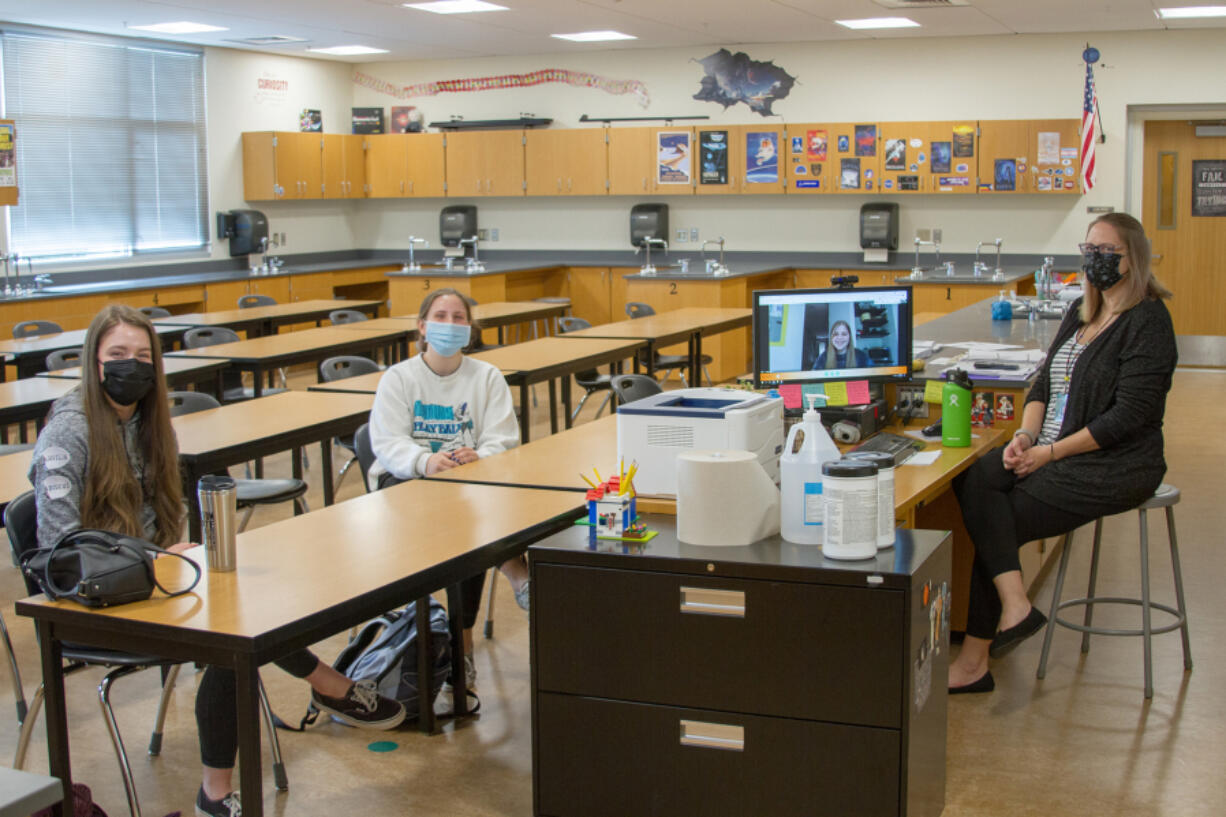 WOODLAND: From left is senior Ruby Heidgerken, junior Bella Mattison, junior Casey Logan via Google Meets, and teacher Elizabeth Talvitie.