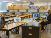 WOODLAND: From left is senior Ruby Heidgerken, junior Bella Mattison, junior Casey Logan via Google Meets, and teacher Elizabeth Talvitie.