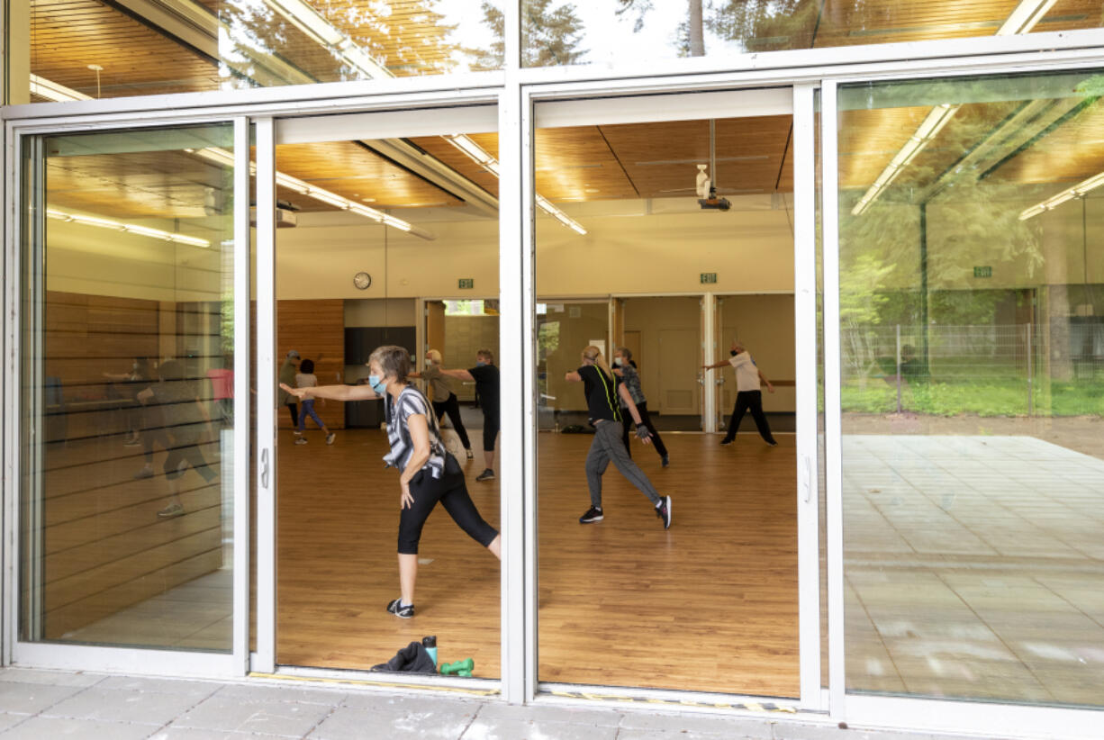 Patrons work out during a cardio and strength class Thursday at the Firstenburg Community Center. The center has recently lessened some of its COVID-19  restrictions and expanded its class offerings.