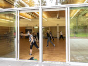 Patrons work out during a cardio and strength class Thursday at the Firstenburg Community Center. The center has recently lessened some of its COVID-19  restrictions and expanded its class offerings.