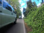 This bike-view photo of a near-miss on Northwest Seward Road shows just how closely some drivers pass beside cyclists in the roadway who have nowhere else to go - no shoulder or bike lane. A 2020 state law requires that drivers give cyclists in the road at least 3 feet of space, if not a whole lane.