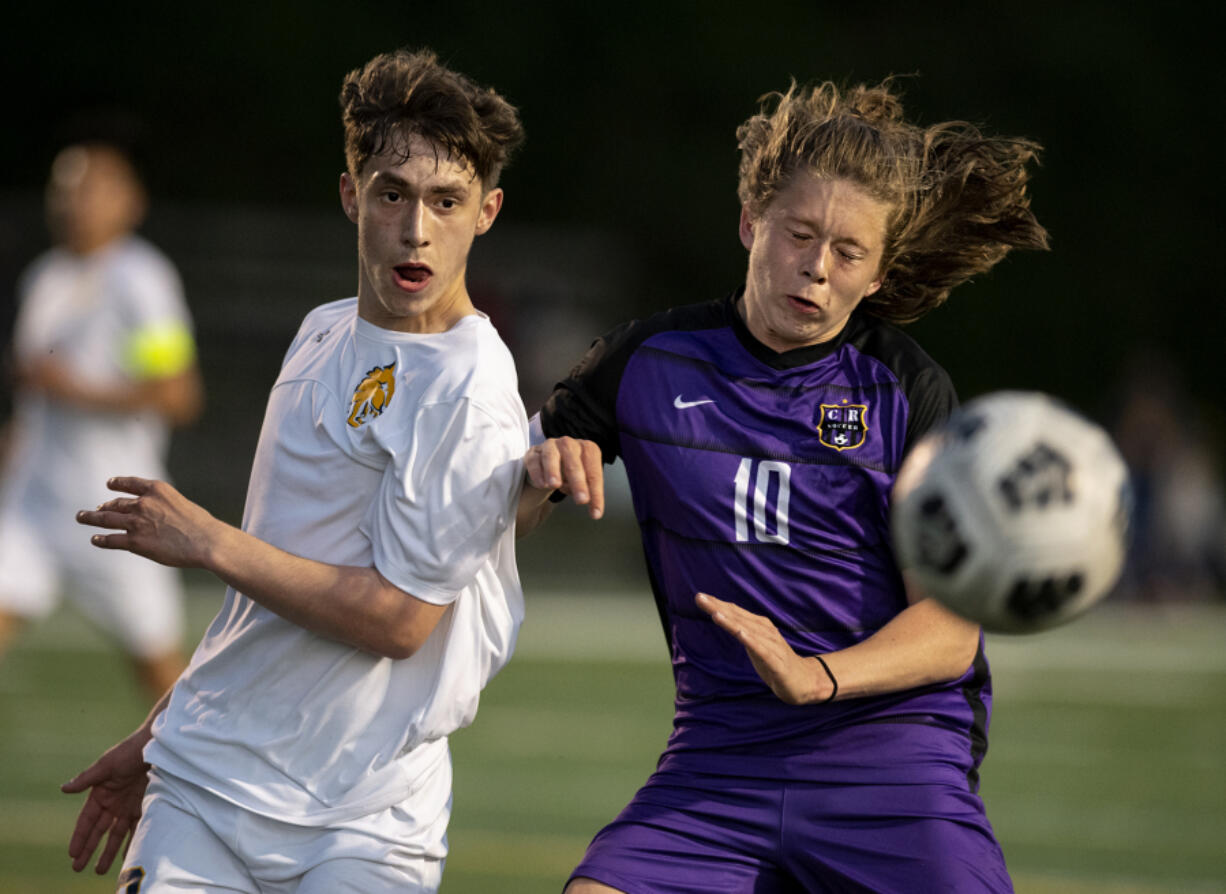 Columbia River'is Greer Snellman battles for a ball with an Aberdeen defender in a 2A Southwest District boys soccer semifinal on Thursday, May 6, 2021, at Columbia River High School. The Rapids topped Aberdeen 2-0 to advance to Saturday'is championship game against Tumwater.