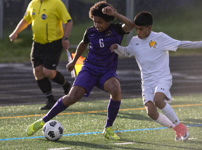 Columbia River’s Carver Taylor cuts back against an Aberdeen defender in a 2A Southwest District boys soccer semifinal on Thursday, May 6, 2021, at Columbia River High School. The Rapids topped Aberdeen 2-0 to advance to Saturday’s championship game against Tumwater.