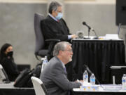 Former Clark County manager Mark McCauley, center, testifies Monday in the trial for a lawsuit brought by Don Benton against the county as Superior Court Judge Gregory Gonzales, top, looks on at the Clark County Event Center at the Fairgrounds.