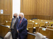 Plaintiffs Christopher Clifford, left, and Don Benton stand after the verdict in their lawsuit trial in a nearly empty courtroom at the Clark County Courthouse on Thursday morning, May 20, 2021.