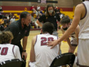 Prairie's head coach Kyle Brooks talks to his players after the first quarter against Mountain View on Wednesday at Prairie High School. Even though Mountain View won this game 66-57, Brooks will leave the Falcons with more than 360 victories, seven league titles and many trips to state.