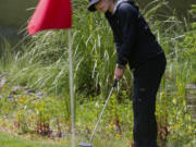 Union’s Jade Gruher putts from the fringe on the 17th hole in the 4A/3A district girls golf championships on Thursday, May 27, 2021, at Lewis River Golf Course in Woodland. Union sophomore Jade Gruher won the 4A title with a 76-77-185 total over two days. Kelso senior Liz Dolan scored a 74-80-186 to win the 3A title.