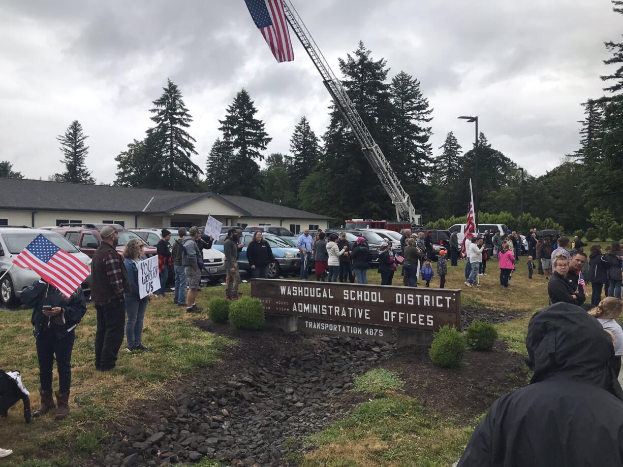 Parents gather outside the Washougal School District headquarters Tuesday night before a school board meeting.