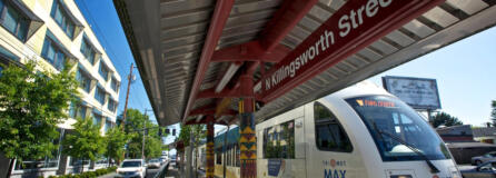 A northbound Yellow Line Max train, left, stops at the Killingsworth station in Portland, and an articulated hybrid bus, right, of the type used on C-Tran's bus rapid transit route, The Vine, is seen in Vancouver.  The question of whether TriMet's Yellow Line should be extended to Vancouver was a key point of contention during development of the Columbia River Crossing project and is often cited as one of the main disagreements that derailed the project. The current renewed replacement effort will consider both light rail and bus rapid transit options to meet the project's high-capacity transit needs, and no decision has been made yet - but recent comments from federal lawmakers pushed the still-simmering disagreement back into the spotlight.