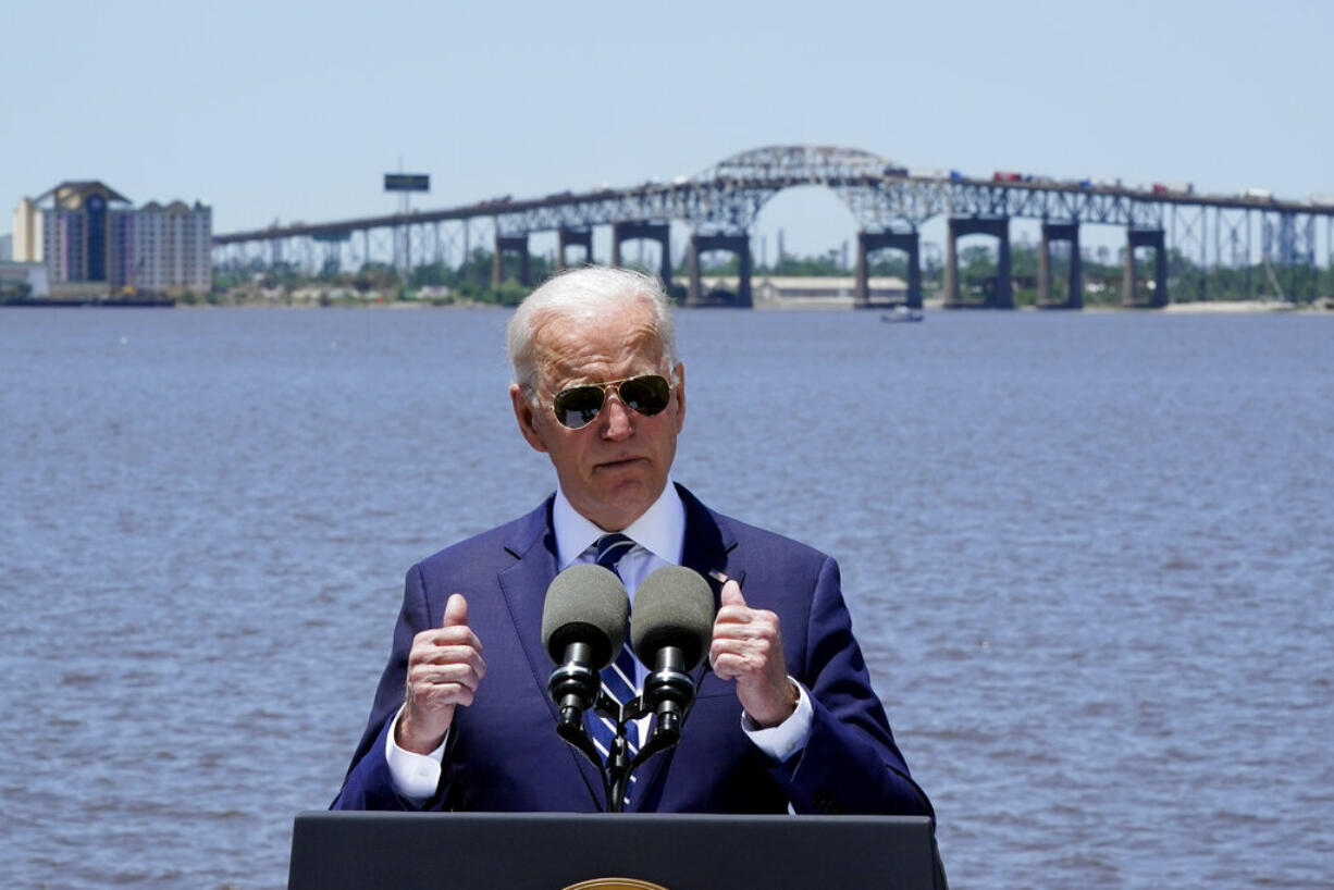 President Joe Biden speaks with the Interstate 10 Calcasieu River Bridge behind him, Thursday, May 6, 2021, in Lake Charles, La.