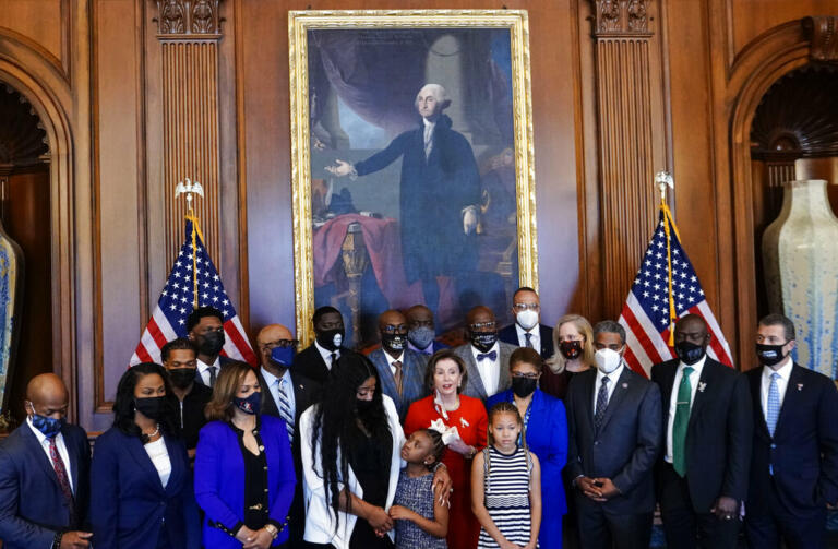 House Speaker Nancy Pelosi, D- Calif., speaks to reporters while standing with members of the Floyd family prior to a meeting to mark the anniversary of the death of George Floyd, Tuesday, May 25, 2021 at the Capitol in Washington.