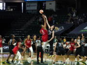 Las Vegas Aces' Liz Cambage (8) tips-off against Seattle Storm's Breanna Stewart to start the first half of a WNBA basketball game and their season Saturday, May 15, 2021, in Everett, Wash.