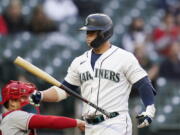 Seattle Mariners' Ty France walks away from the plate after striking out against the Los Angeles Angels during the third inning of a baseball game Saturday, May 1, 2021, in Seattle.