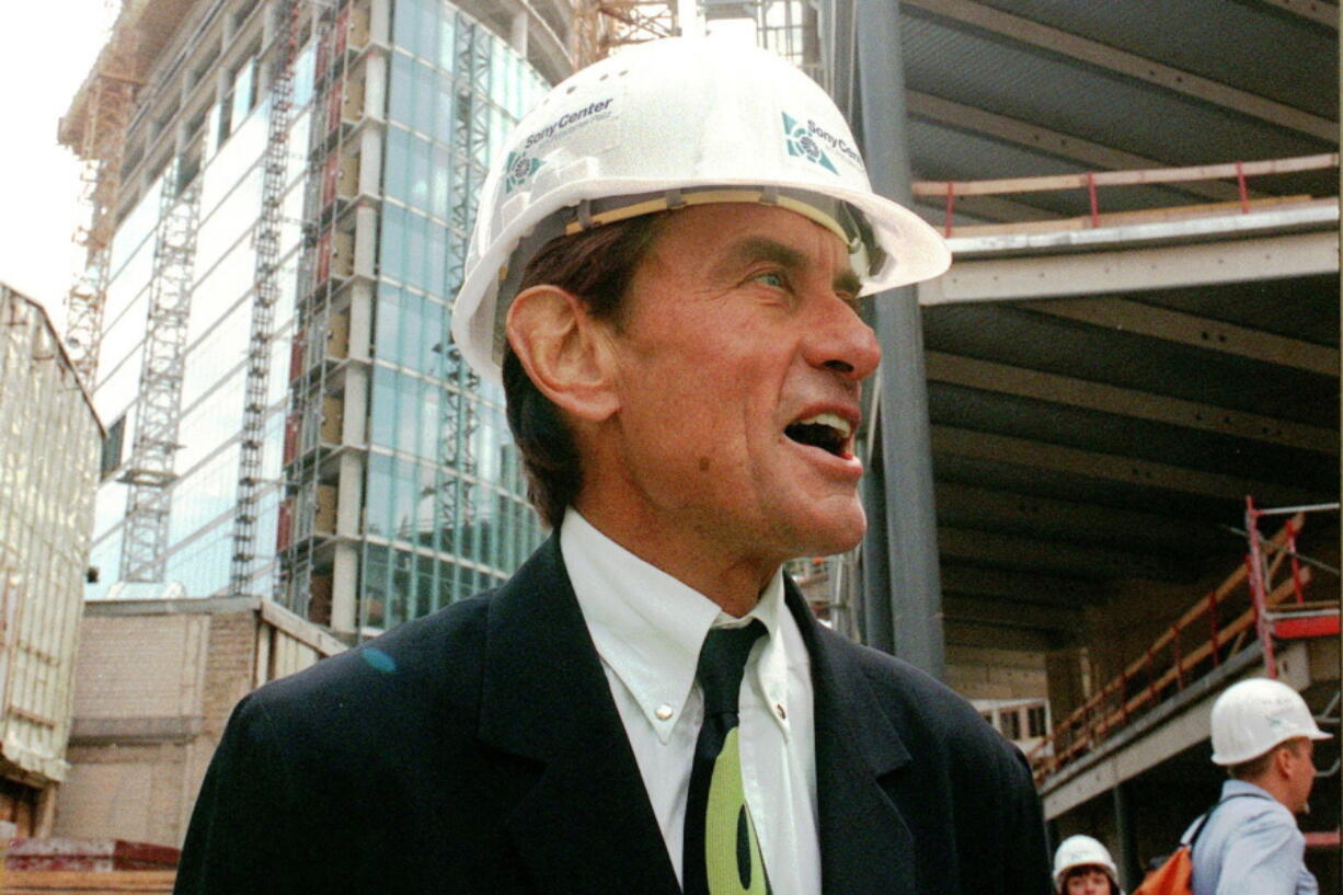 CORRECTS TO WEST, NOT EAST - FILE - In this Wednesday, July 15, 1998 file photo, architect Helmut Jahn tours a construction site in Berlin. Jahn, 81, was killed when two vehicles struck the bicycle he was riding on Saturday afternoon, May 8, 2021, while riding north on a village street in Campton Hills, about 55 miles west of Chicago.