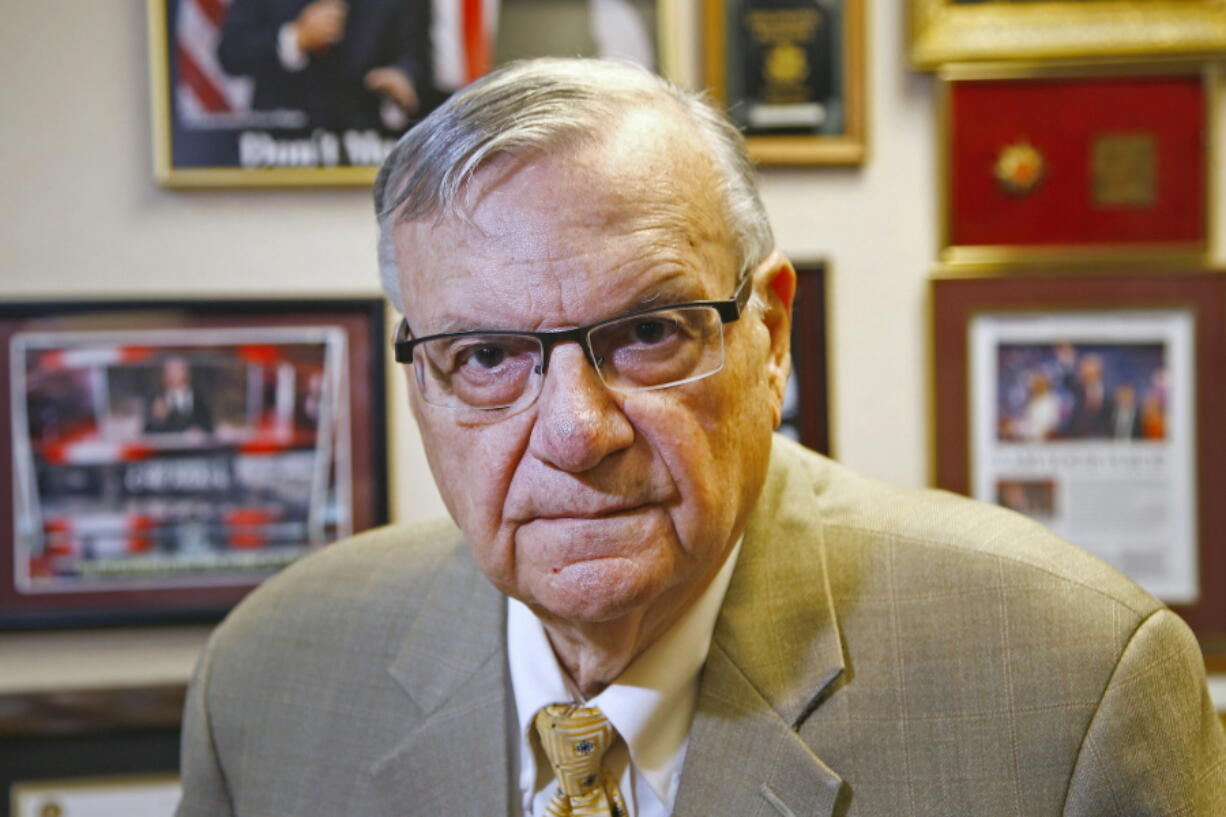 FILE - In this Aug. 26, 2019, file photo, former Maricopa County Sheriff Joe Arpaio poses for a portrait at his private office in Fountain Hills, Arizona. The taxpayer costs for the racial profiling lawsuit stemming from the immigration patrols launched a decade ago by Arpaio are expected to reach $202 million by the summer of 2022. Officials approved a tentative county budget Monday, May 17, 2021, that provides $31 million for compliance costs in the fiscal year that begins on July 1. No one in county government can say exactly when those costs will start to decline or end. (AP Photo/Ross D.