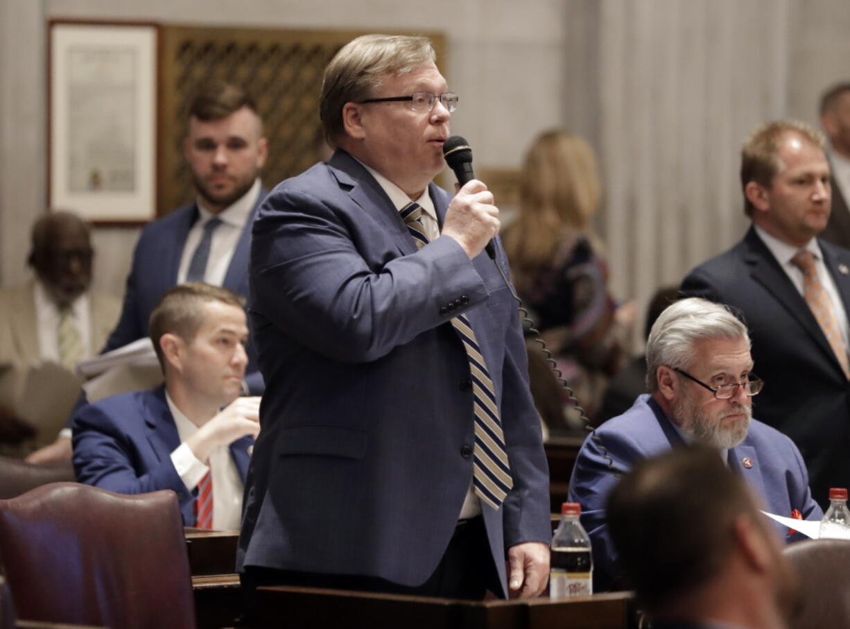 FILE - In this April 15, 2019 file photo, Rep. Tim Rudd, R-Murfreesboro, speaks during a House session in Nashville, Tenn. Rudd, the sponsor of Tennessee's new law requiring businesses and government facilities to post signs if they let transgender people access their preferred, multi-person public bathrooms now says those who refuse could face up to six months in jail. Rudd said this week that the misdemeanor penalty could apply.