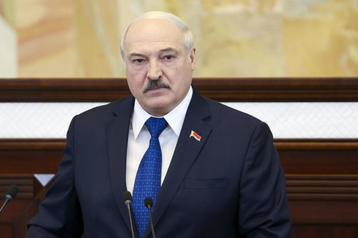 Belarusian President Alexander Lukashenko addresses the Parliament in Minsk, Belarus, Wednesday, May 26, 2021. Lukashenko is defending his action to divert a European flight that triggered bruising European Union sanctions and accused the West of waging a "hybrid war" to "strangle" the ex-Soviet nation. On Sunday, May 23, 2021, Belarusian flight controllers ordered a Ryanair jetliner flying from Greece to Vilnius to land in the country's capital, Minsk because of a bomb threat and a Belarusian fighter jet was scrambled to escort the plane.