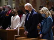 FILE - In this Wednesday, Jan. 20, 2021 file photo, President-elect Joe Biden and his wife, Jill Biden, attend Mass at the Cathedral of St. Matthew the Apostle during Inauguration Day ceremonies in Washington. When U.S. Catholic bishops hold their next national meeting in June 2021, they'll be deciding whether to send a tougher-than-ever message to President Joe Biden and other Catholic politicians: Don't partake of Communion if you persist in public advocacy of abortion rights.