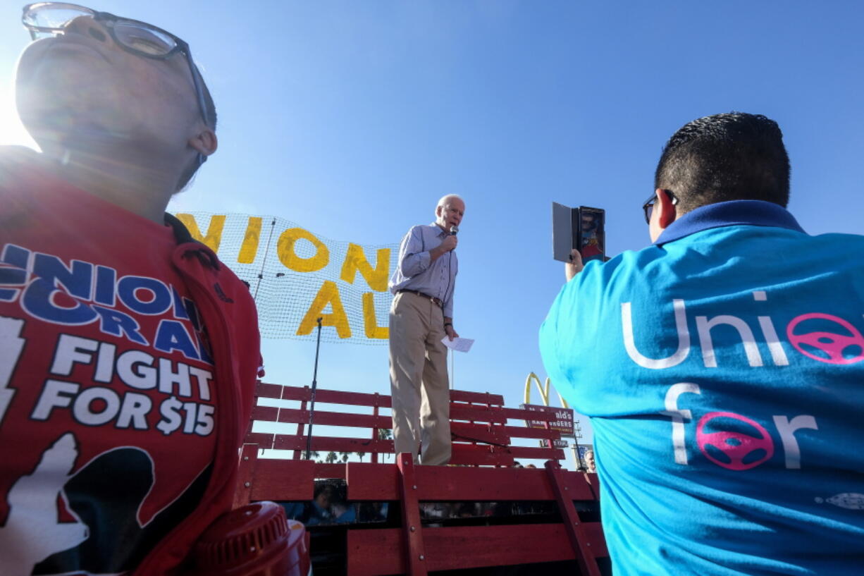 FILE - In this Dec. 19, 2019, file photo Democratic presidential candidate former Vice President Joe Biden, speaks at a rally in support of McDonald's cooks and cashiers who are demanding higher wages and union rights, outside a McDonald's restaurant in Los Angeles. The Biden administration is giving a bit of simple advice to businesses that are unable to find workers: Offer them more money. Boosting wages gets at the central promise of the Biden presidency to improve the lives of everyday. (AP Photo/Ringo H.W.