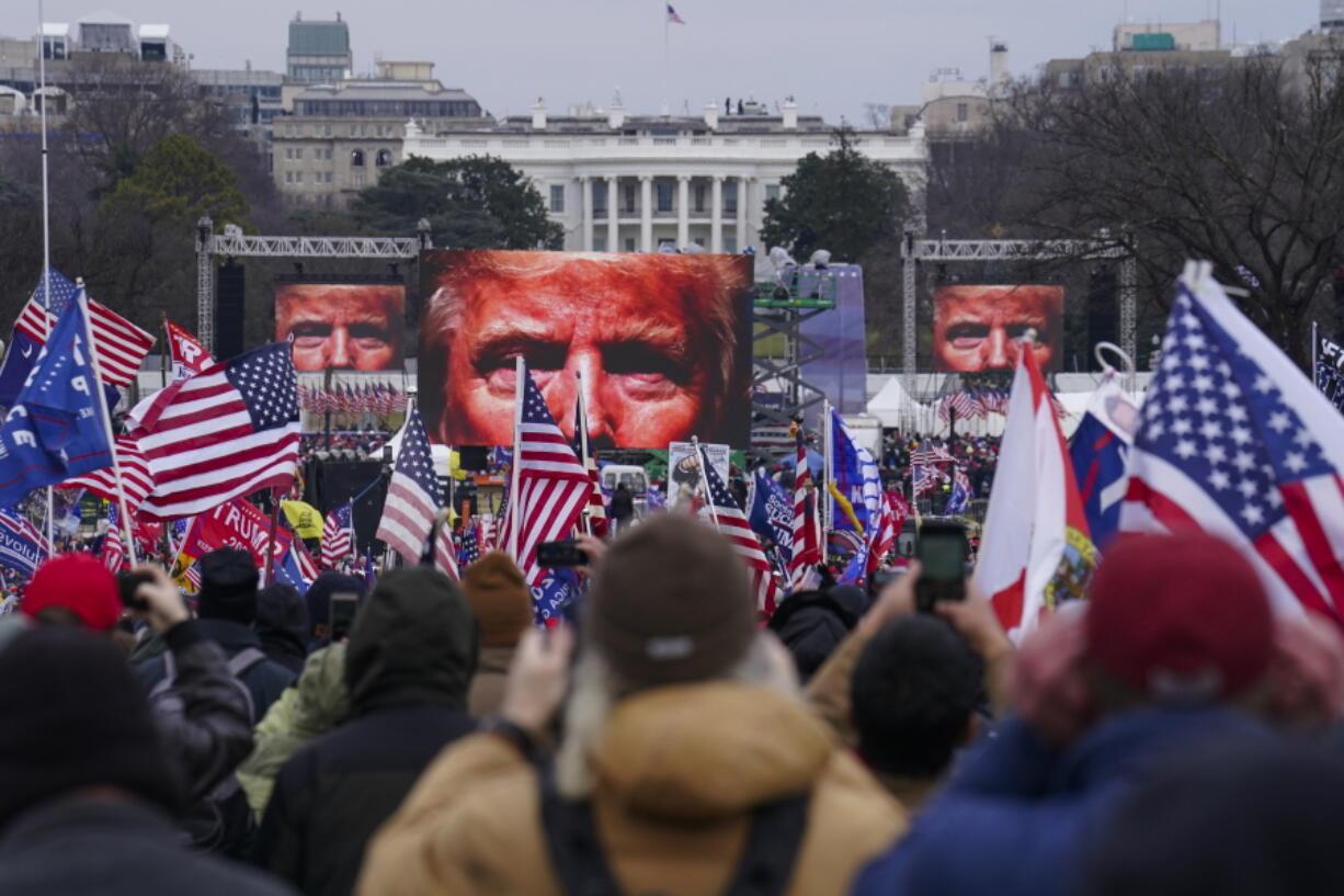 FILE - In this Jan. 6, 2021 file photo, Trump supporters participate in a rally in Washington. Many of those who stormed the Capitol on Jan. 6 cited falsehoods about the election, and now some of them are hoping their gullibility helps them in court. Attorneys for several defendants facing charges connected to the deadly insurrection say they will raise their client's belief in conspiracy theories and misinformation, either as an explanation for why they did what they did, or as an attempt to create a little sympathy.