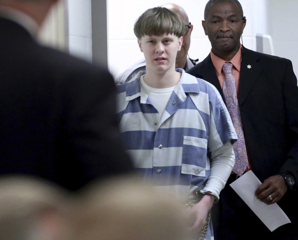 FILE - In this April 10, 2017, file photo, Dylann Roof enters the courtroom at the Charleston County Judicial Center in Charleston, S.C. On Tuesday, May 25, 2021, Roof, on federal death row for the racist slayings of nine members of a Black South Carolina congregation, is making his appellate argument that his conviction and death sentence should be overturned.