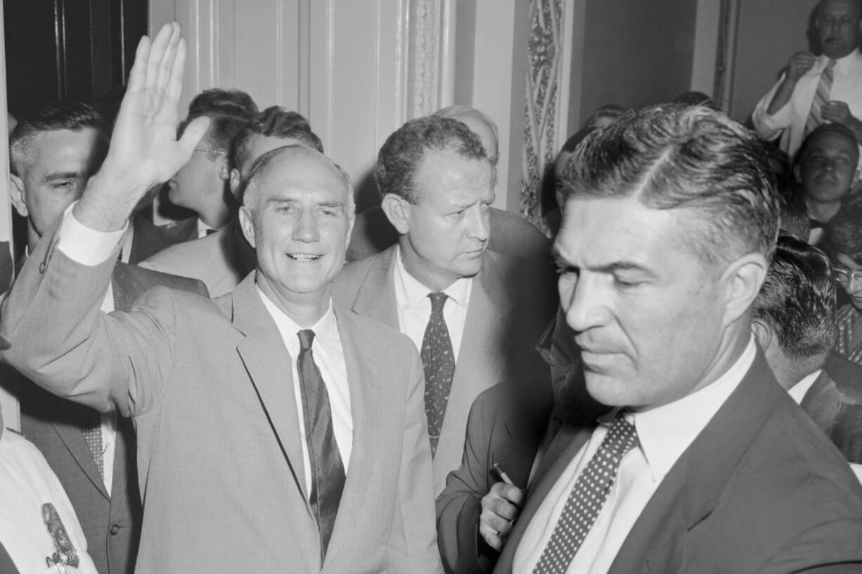 FILE - In this Aug. 29, 1957, file photo, Sen. Strom Thurmond, R-S.C., waves as he leaves the Senate chamber at end of his 24 hour, 18 minute filibuster against the Civil rights Act. Senate Republicans are poised to use a filibuster to derail Democrats' effort to launch a bipartisan probe of the Jan. 6 attack on the Capitol. The showdown will be the first time this year the GOP has used the delaying tactic to try killing major legislation, Thurmond talked on the Senate floor in the longest Senate speech by a single senator for which there are records of speaking length.