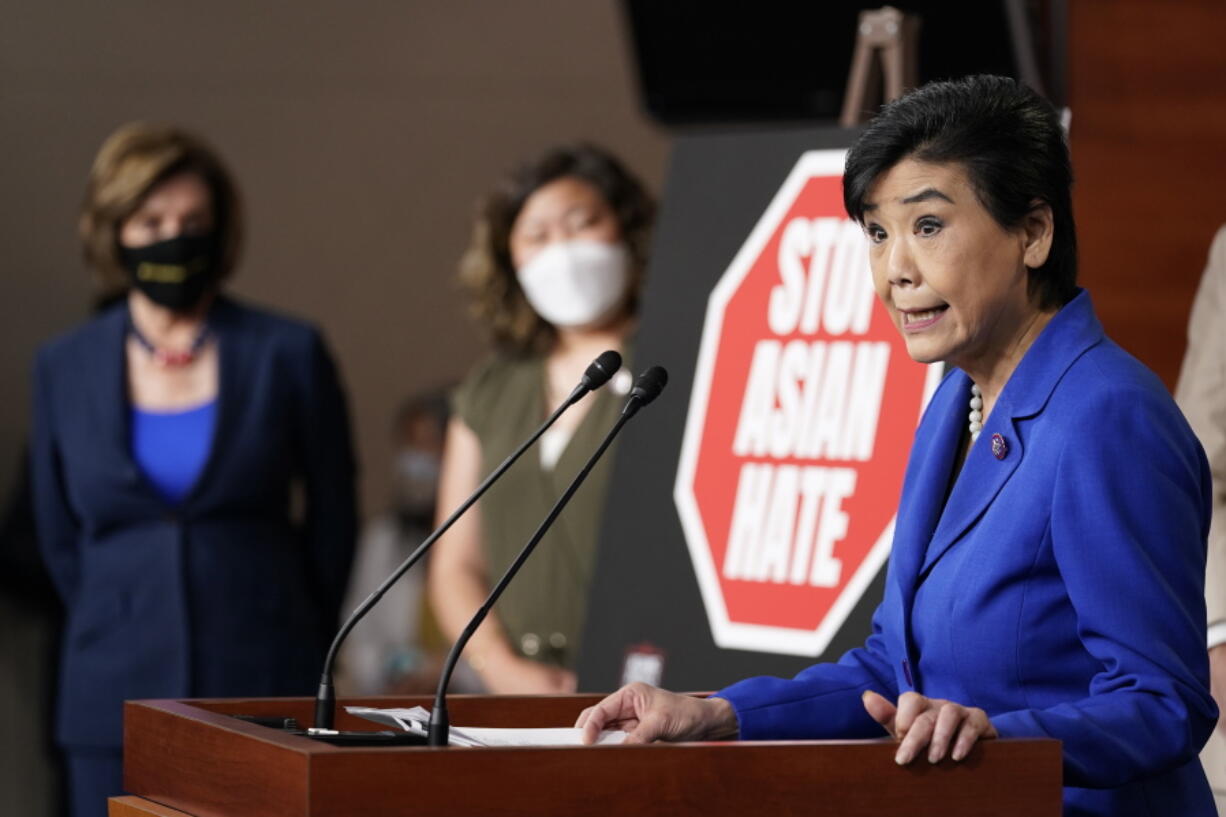 Rep. Judy Chu, D-Calif., right, speaks during a news conference on Capitol Hill in Washington, Tuesday, May 18, 2021, on the COVID-19 Hate Crimes Act as House Speaker Nancy Pelosi of Calif., left, and Rep. Grace Meng, D-N.Y., center, listen.