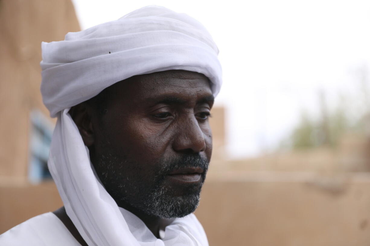 Abdullah Jaber, whose son Mubarak died in a migrant ship sinking last month, sits at his home in Khartoum, Sudan,  Friday, April 30 2021. When more than 100 Africans hoping to reach Europe on a rubber boat called repeatedly for help in late April, a rescue never came. In all, approximately 130 people are believed to have died off the Libyan coast. It was the deadliest wreck so far this year in the Mediterranean Sea and has renewed accusations that European countries are failing to help migrant boats in trouble.