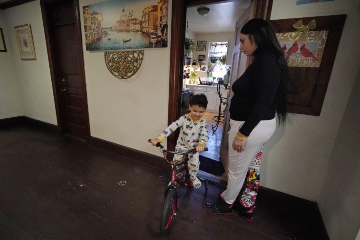 FILE - In this March 10, 2021, file photo, Isabel Miranda's 4-year-old son, Julian, rides his bike into the hallway of their rental apartment in Haverhill, Mass. A federal judge has ruled, Wednesday, May 5, 2021, that the Centers for Disease Control exceeded its authority when it imposed a federal eviction moratorium to provide protection for renters out of concern that having families lose their homes and move into shelters or share crowded conditions with relatives or friends during the pandemic would further spread the highly contagious virus. Miranda and her family would no longer have this eviction protection if this ruling stands.