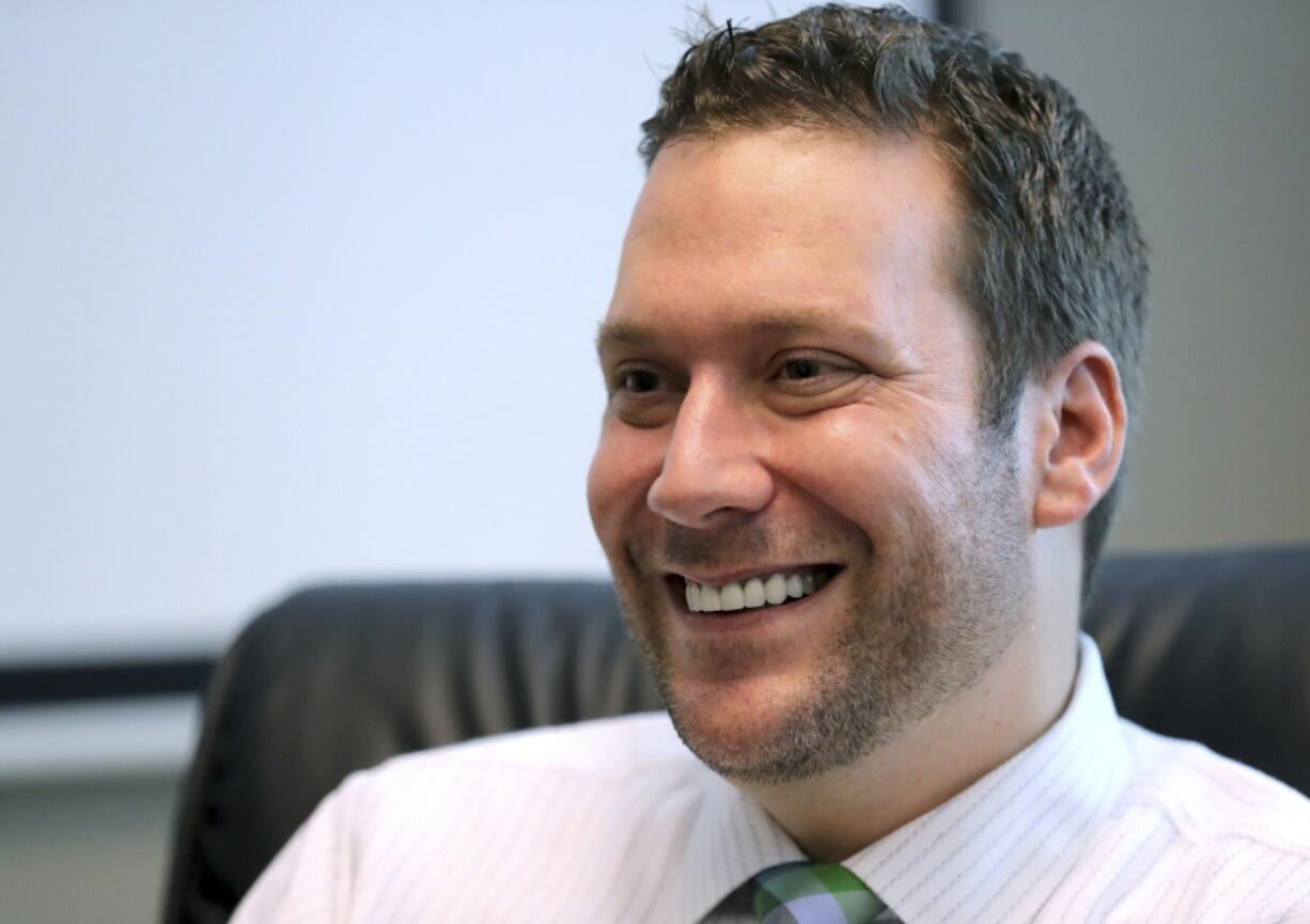 FILE - In this Sept. 30, 2019, file photo, Seminole County Tax Collector Joel Greenberg talks to the Orlando Sentinel during an interview at his office in Lake Mary, Fla. A key figure in the federal investigation of Republican Rep. Matt Gaetz is expected to plead guilty to criminal charges next week. Joel Greenberg will appear Monday in federal court in Orlando, Florida for a change of plea hearing, according to court documents.