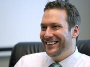 FILE - In this Sept. 30, 2019, file photo, Seminole County Tax Collector Joel Greenberg talks to the Orlando Sentinel during an interview at his office in Lake Mary, Fla. A key figure in the federal investigation of Republican Rep. Matt Gaetz is expected to plead guilty to criminal charges next week. Joel Greenberg will appear Monday in federal court in Orlando, Florida for a change of plea hearing, according to court documents.