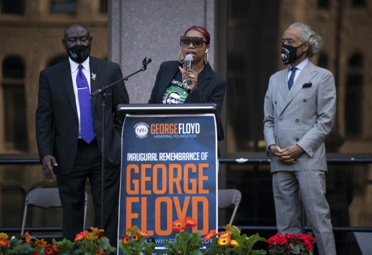 George Floyd's sister, Bridgett Floyd, addresses a rally in downtown Minneapolis, Sunday, May 23, 2021. At left is attorney Ben Crump. At right is the Rev. Al Sharpton. "It has been a long year.