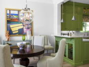 This image provided by Tom Stringer Design Partners shows a kitchen and dining room. Color is a simple way to create an upbeat feel, says John Cialone of Tom Stringer Design Partners in Chicago. The firm recently completed a Palm Springs, California, project where they brought in a vibrant kiwi green.