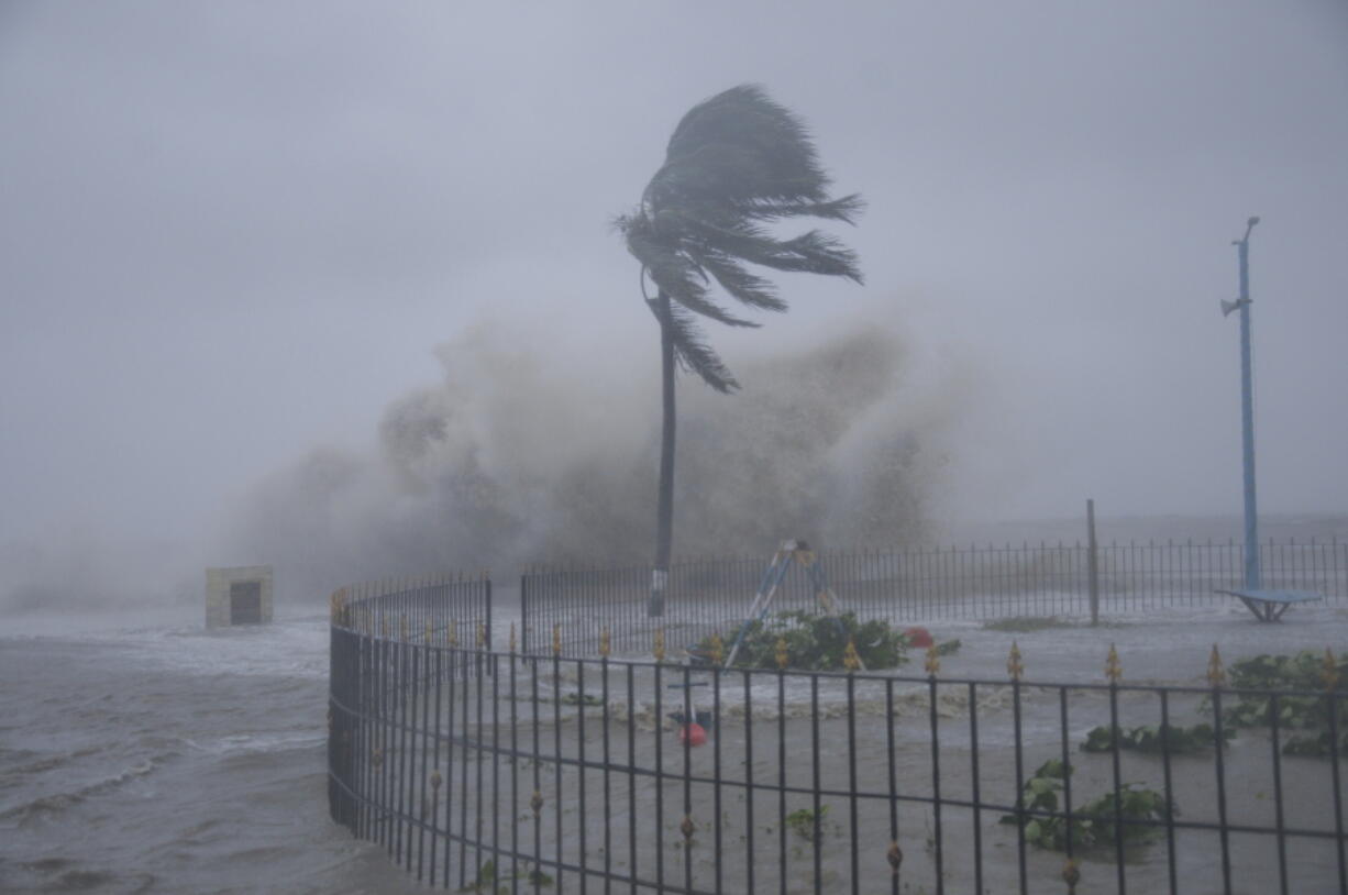 Heavy winds and sea waves hit the shore at the Digha beach on the Bay of Bengal coast as Cyclone Yaas intensifies in West Bengal state, India, Wednesday, May 26, 2021. Heavy rain and a high tide lashed parts of India's eastern coast as the cyclone pushed ashore Wednesday in an area where more than 1.1 million people have evacuated amid a devastating coronavirus surge.