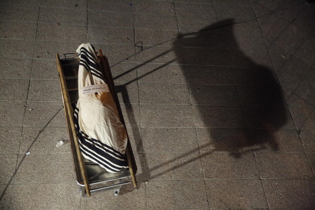 The body of Menachem Knoblowitz, 21, from Borough Park, Brooklyn in the United States, who died during Lag BaOmer celebrations at Mt. Meron in northern Israel, is displayed during his funeral in Jerusalem on Saturday, May 1 2021. A stampede at a religious festival attended by tens of thousands of ultra-Orthodox Jews in northern Israel killed dozens of people and injured about 150 early Friday, medical officials said. It was one of the country's deadliest civilian disasters.