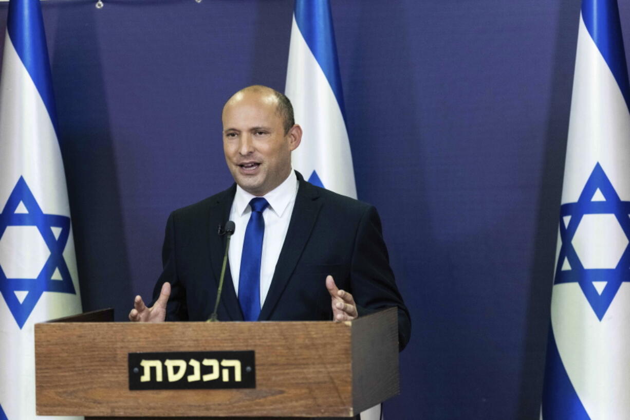 Yemina party leader Naftali Bennett speaks to the Israeli Parliament in Jerusalem, Sunday, May 30, 2021.