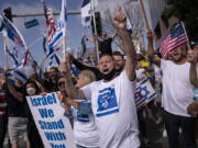 FILE - Pro-Israel supporters chant slogans during a rally in support of Israel outside the Federal Building in Los Angeles, Wednesday, May 12, 2021. A larger debate is playing out nationwide among many U.S. Jews who are divided over how to respond to the violence and over the disputed boundaries for acceptable criticism of Israeli policies. (AP Photo/Jae C.