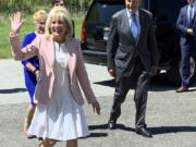 First lady Jill Biden arrives at a vaccination clinic Thursday, May 13, 2021, at a high school in Charleston, W.Va. Behind her are U.S. Sen. Joe Manchin of West Virginia and his wife, Gayle Manchin.