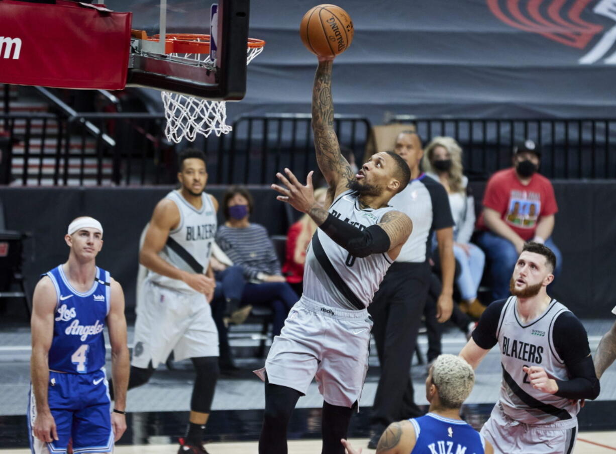 Portland Trail Blazers guard Damian Lillard shoots against the Los Angeles Lakers during the second half of an NBA basketball game in Portland, Ore., Friday, May 7, 2021.