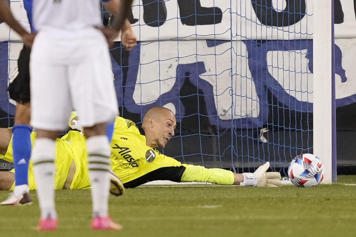 Portland Timbers goalkeeper Logan Ketterer blocks a penalty kick by San Jose Earthquakes forward Chris Wondolowski during the second half of an MLS soccer match, Saturday, May 15, 2021, in San Jose, Calif.