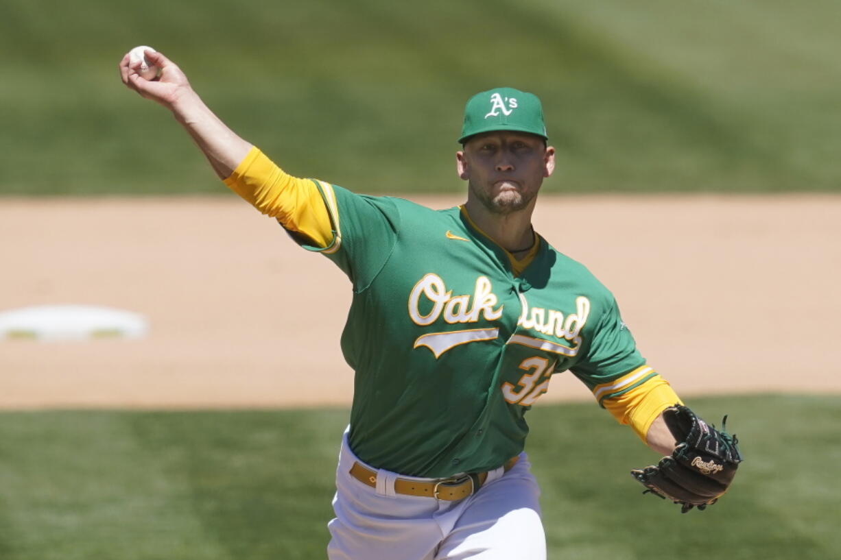 Oakland Athletics' James Kaprielian pitches against the Seattle Mariners during the seventh inning of a baseball game in Oakland, Calif., Wednesday, May 26, 2021.