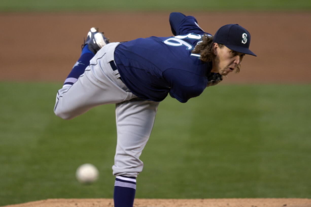 Seattle Mariners pitcher Logan Gilbert follows through on a throw to an Oakland Athletics batter during the first inning of a baseball game Tuesday, May 25, 2021, in Oakland, Calif. (AP Photo/D.