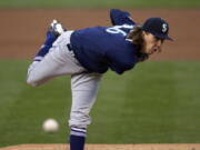 Seattle Mariners pitcher Logan Gilbert follows through on a throw to an Oakland Athletics batter during the first inning of a baseball game Tuesday, May 25, 2021, in Oakland, Calif. (AP Photo/D.